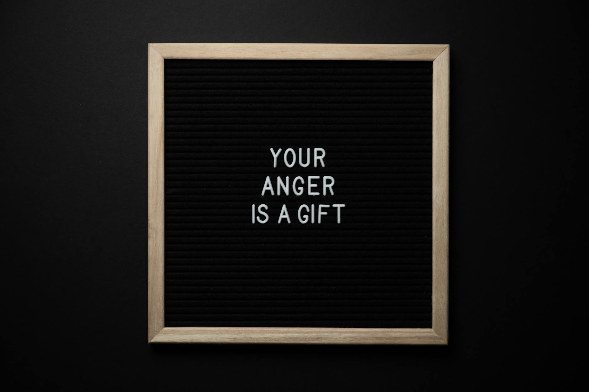 blackboard with phrase your anger is a gift